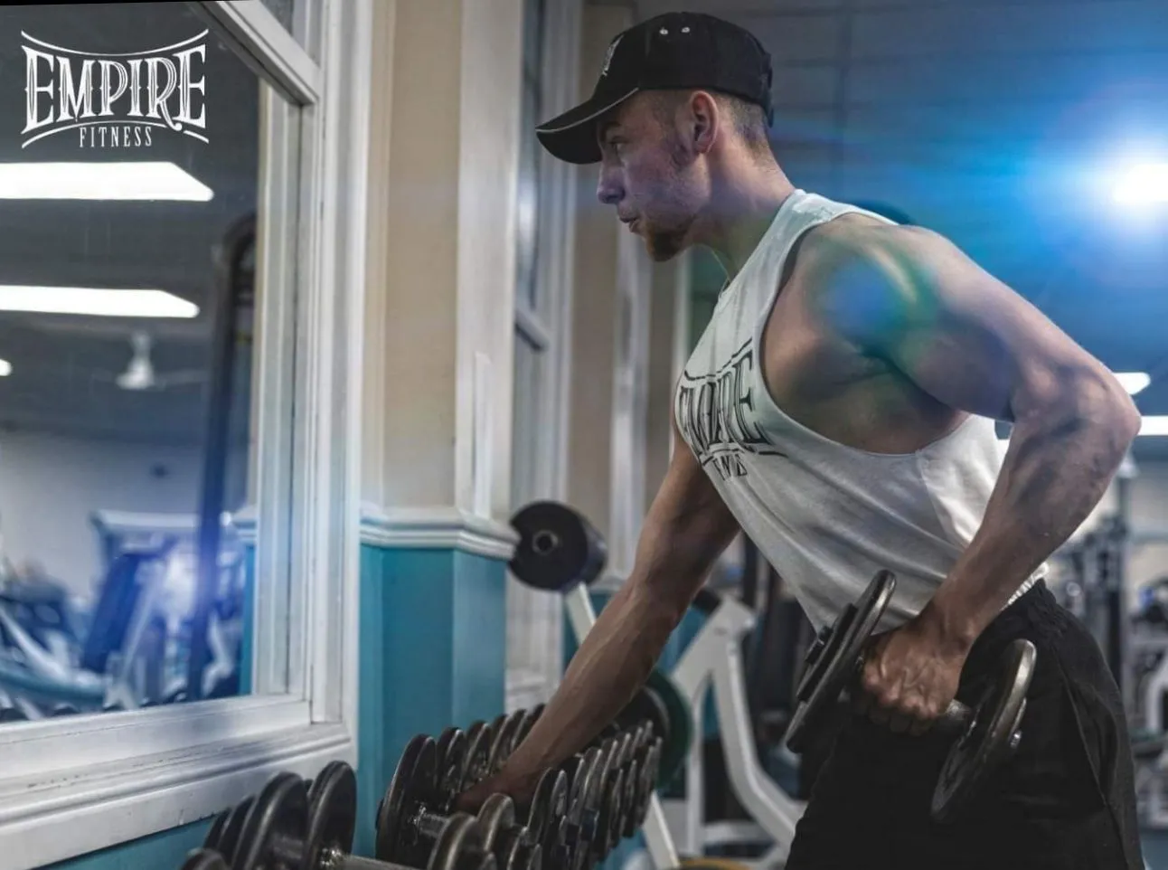 James Whiting training with a dumbbell at Empire Fitness in Hinckley